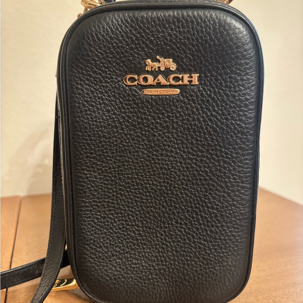 Coach Eva Pebbled Dark leather smartphone Crossbody Bag